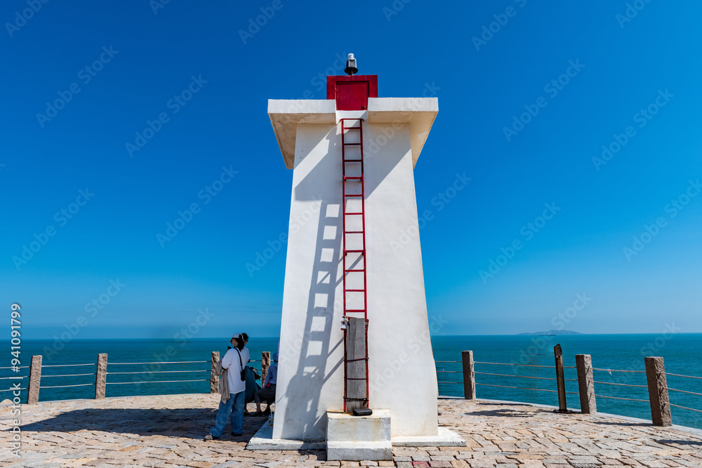 Sticker lighthouse on the coast