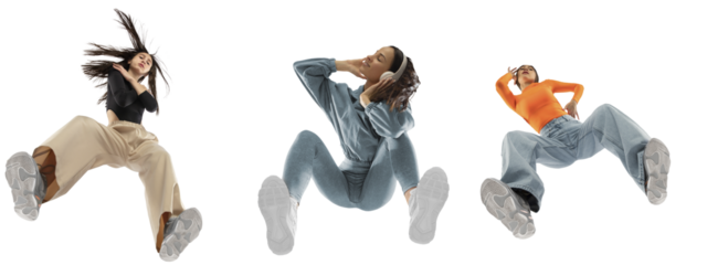 Young trendsetters, stylish girls wearing cool clothes, comfortable and cutting-edge clothes, isolated on white background, shot from the bottom. Concept of fashion, youth, clothes, freedom