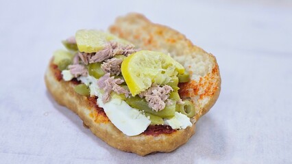Fricasse with Tuna, Pickled Lemon, Hard-Boiled Egg, Harissa, Olives, and Pickles – פריקסה Tunisian Treat