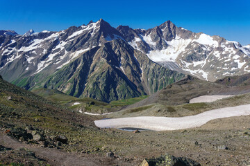 mountainous landscape with high peaks and glaciers