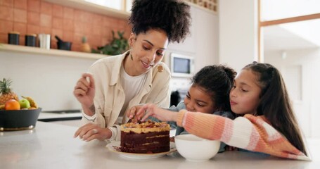Woman, children and decoration a birthday cake on table, party and bonding together in kitchen. Young mom, daughter and family talking with learning to bake, food and celebration dessert in home