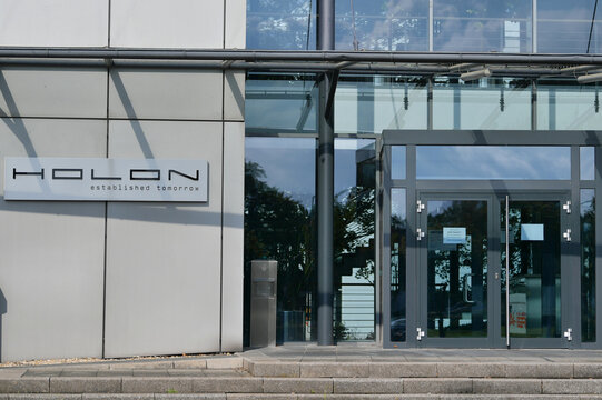 Paderborn, Germany - August 25. 2024: View on logo or lettering of BENTELER subsidiary HOLON, HOLON Mover is a fully electric and autonomous vehicle for use on public roads