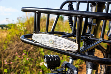 White reflective reflector on bicycle mounted at front