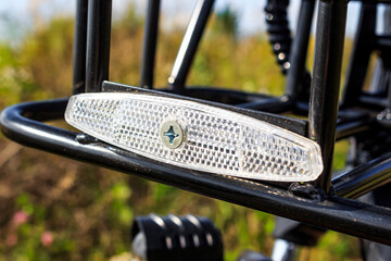 White reflective reflector on bicycle mounted at front