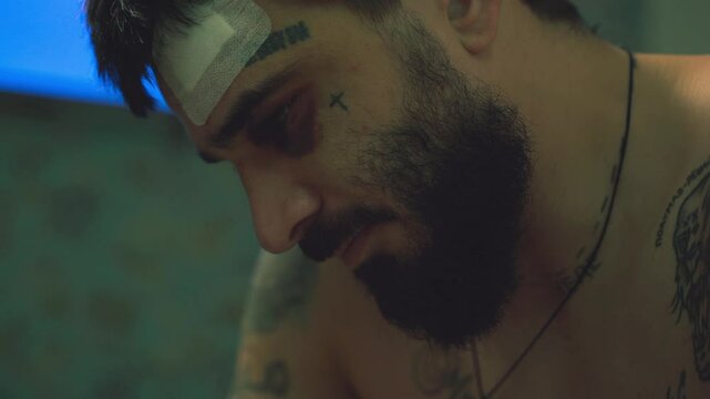 A man with tattoos on his face
