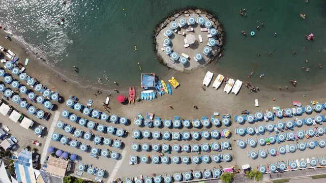 Aerial view of the coast of Liguria (Italy) with its sea, beaches and parasols