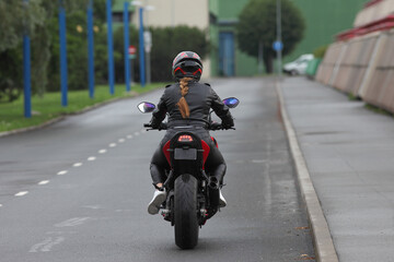 Naklejka premium young woman on a motorcycle