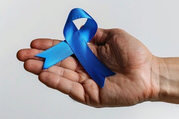 Doctor hand holding blue ribbon, cancer awareness concept