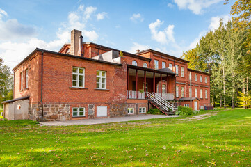Fototapeta premium Red brick manor in Allikukivi, Estonia. Backyard.
