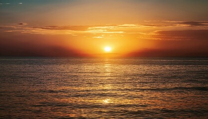 Obraz premium Sunset over a field with mountains in the background