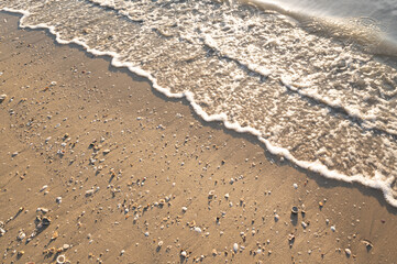 Sand and sea wave background and texture.