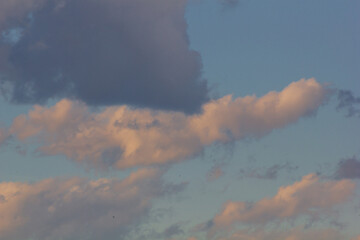 Sunset with clouds in the sky over a modern city.
