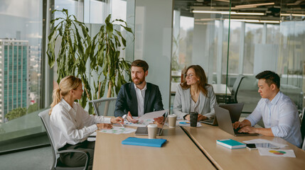 A diverse, talented team collaborates effectively in a bright office space during a business meeting