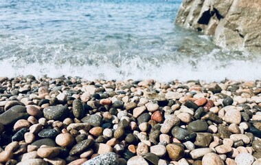 Pebble beach on the sand in the Mediterranean Sea.
