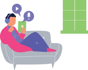 Obraz premium Boy sitting on sofa listening to podcast.