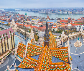 Scenic view from the bell tower of Matthias Church on Fisherman's Bastion and houses along Danube...