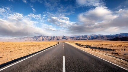 Empt Road leading trough dessert mountains and blu sky wiyh clouds in background 