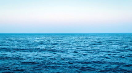 Obraz premium Tranquil blue sea horizon with a soft sky.