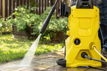 Pressure Washer for Washing Garden and Home. High Pressure Cleaner Karcher Cleaning Paving Slabs...