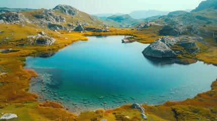 Fototapeta premium A drone perspective of a tranquil mountain lake with reflections