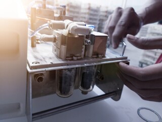 Vaccinator repair and service the vaccine injector machine.