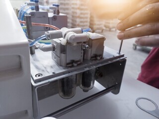 Vaccinator repair and service the vaccine injector machine.