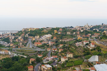 A Verdant View of Coastal Italian Town With Winding Roads and Green Hills