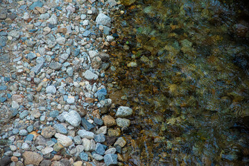 It is a landscape of a mountain stream.
A feast of water and pebbles.