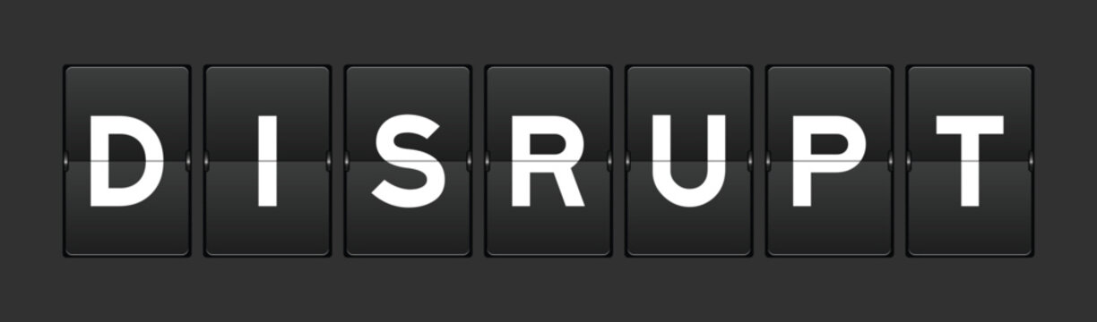 Black color analog flip board with word disrupt on gray background