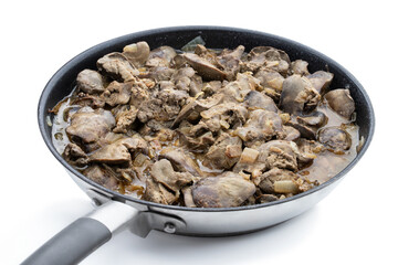 Stewed chicken liver with sauce and onion in iron skillet isolated on white