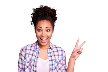 Close-up portrait of her she nice charming cute attractive winsome lovely cheerful cheery wavy-haired girl in checked shirt showing v-sign good mood isolated over violet purple pastel background