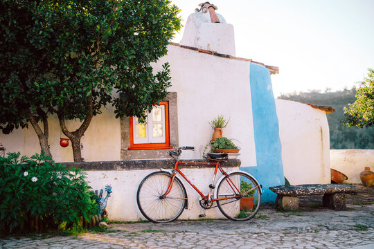 Red Bicycle on Street in Aldeia da Mata Village, Portugal