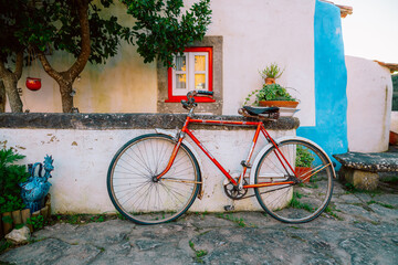 Red Bicycle on Street in Aldeia da Mata Village, Portugal