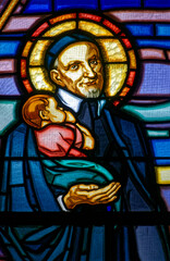 Obraz premium A stained glass of Saint Vincent de Paul. Vitrail de Saint Vincent de Paul.