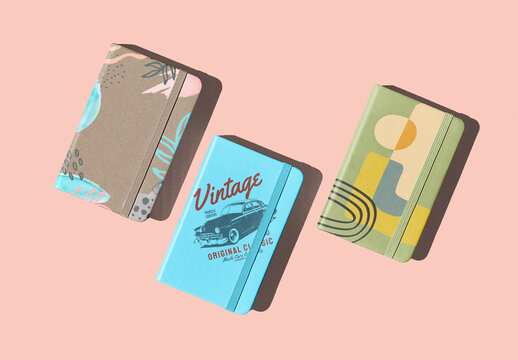 Multiple notebooks in hard light with strong shadows. Notebook for mockup template. 