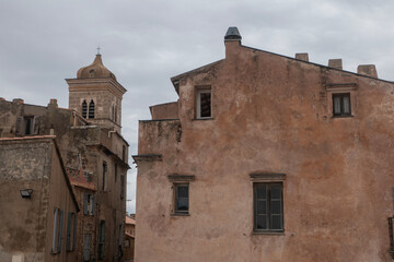 Facade of weathered buildings in old town Bonifacio. Corsica.