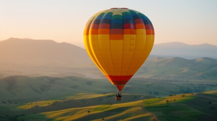 Fototapeta premium Vibrant hot air balloon soaring over lush valley, winding road, majestic mountains at sunrise, embodying adventure and the allure of exploration