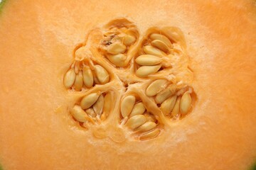 Cut Cantaloupe melon as background, top view