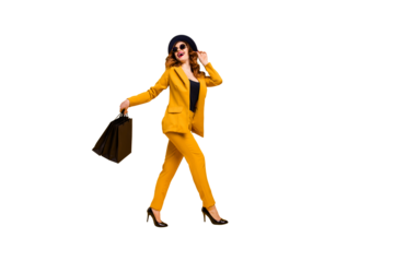 Full length side profile body size photo beautiful she her lady walking down street carry new clothes packs perfect look traveler wear specs formal-wear costume suit isolated yellow bright background