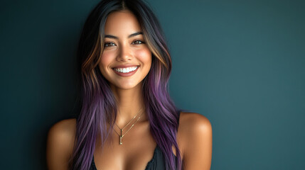 Naklejka premium A cheerful portrait of a young woman with long, purple-streaked hair, exuding warmth in a casual black top against a dark background. Her radiant smile conveys happiness and positivity.
