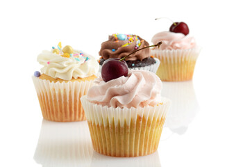 closeup of chocolate vanilla cherry buttercream cupcakes