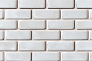 Close-up view of a white subway tile wall, showcasing a sleek and modern design perfect for interior design inspiration and home decor projects.