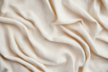 Obraz premium Elegant beige fabric background with soft drapes and folds, perfect for use in fashion, design, and textile graphy projects.
