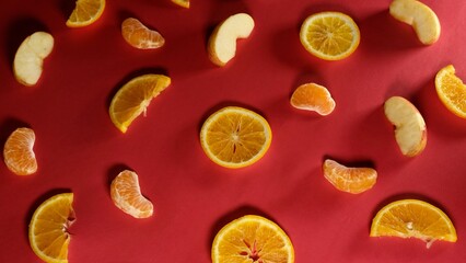 fresh organic fruits decorated with patterns on red background 