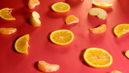 fresh organic fruits decorated with patterns on red background 