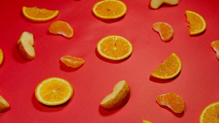fresh organic fruits decorated with patterns on red background 