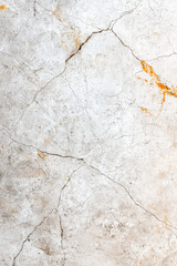 Obraz premium Close-up of a cracked and weathered concrete surface with visible fissures and natural texture, ideal for backgrounds and textures.