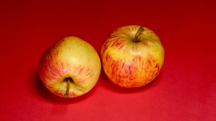 Fresh apple cutting slice on red background 