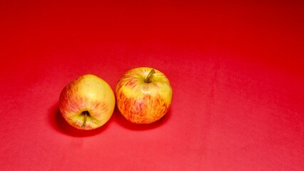 fresh apple on red background 