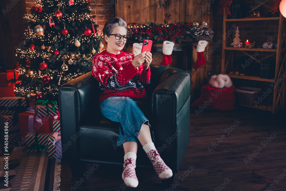 Sticker Photo of cute positive woman wear red print xmas sweater glasses getting christmas sms instagram twitter telegram facebook indoors apartment room